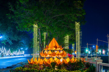 Beautiful light color Decorated Krathong Made in front of Naresuan Bridge for The Loy Krathong festival 2024 at night in Phitsanulok, the full moon of the 12th month Be famous festival of Thailand.