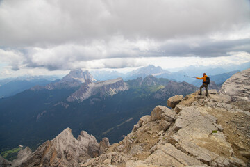 Hiker enjoys the view from Tofana di Mezzo in the italian Dolomites.