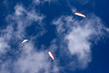 Paragliders above the alps in the dolomites, South Tyrol