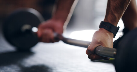 Man, hands and weightlifting with barbell at gym for workout, exercise or muscle gain. Closeup, male person or bodybuilder with iron bar for strength training, fitness or bicep curl at health club