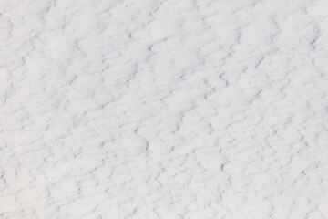 The snow is white and the ground is covered in it