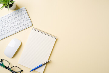 Office desk with computer keyboard, mouse, glasses, notebook and pen. Top view with copy space. Flat lay