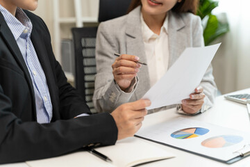 Financial consult planning investor asses and present to client, Close up shot client and advisor review investment strategy in the office.