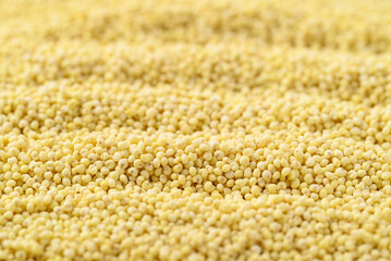 Organic yellow millet grain texture background, Healthy food ingredient