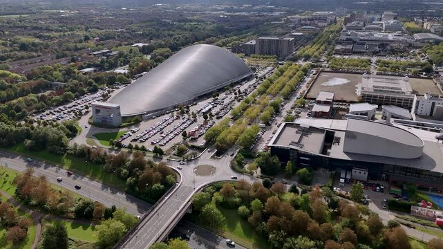 Aerial view circling Milton Keynes infrastructure and contemporary iFLY indoor skydiving centre