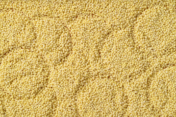 Organic yellow millet grain texture background, Healthy food ingredient