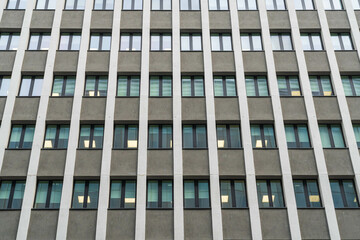 Windows of a modern office block in a pattern, office background element