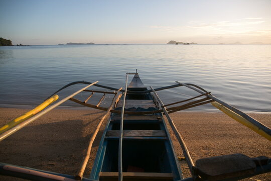 Sunrise boat on a remote beach in Asia