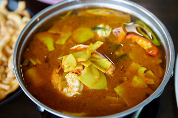 Close-up view of sour soup with shrimp and bamboo shoots in bowl
