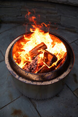 close-up of fire in a fire pit outside in fall