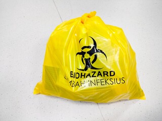 biomedical waste in yellow biohazard bags