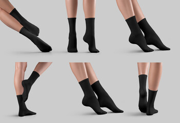 Mockup of black long socks on female legs, diagonal presentation with feet on tiptoes, isolated on...