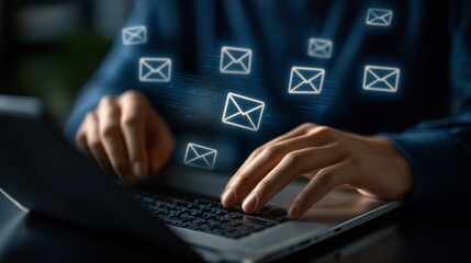 A person typing on a laptop with email icons floating above, symbolizing communication and digital interaction.