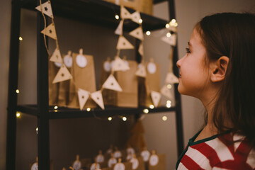 simple Christmas advent calendar made from craft paper bags for kids. easy diy