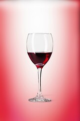 Red Wine in Glass on pink Background