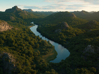 Scenic Mountain Valley with River Winding Through Green Landscape at Sunset
