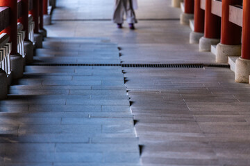 corridor with a tourist in the Buddhist temple