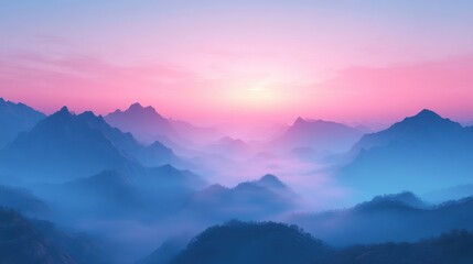 Breathtaking sunrise over misty mountains, showcasing vibrant pink and blue hues in a serene landscape.