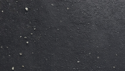 Fototapeta premium Textured Top-Down View of Rough Tarmac Road Surface with Dark, Grainy Detail