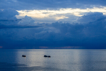 Fishing boats at dusk in the Gulf of Thailand at Ko Tao Island, Thailand.