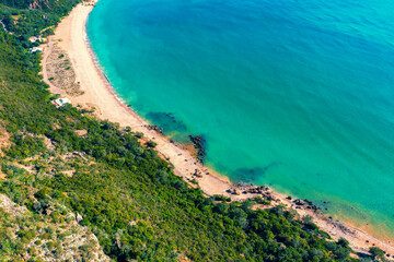 Panoramic aerial view of Arrabida beach. Rocky seascape. Creiro beach. Setubal region, Atlantic Ocean, Portugal