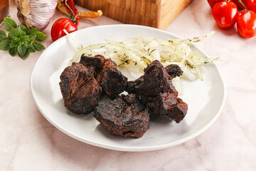 Grilled beef barbecue served onion
