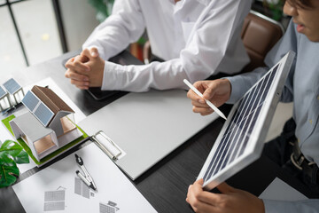 Solar panels green energy Business man working green eco friendly office business creative idea Planing Bio economy for business eco friendly professional Engineer sustainable electricity.