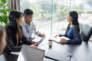 Examiner reading a resume during job interview at office Business and human resources concept.