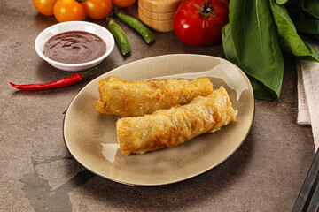 Vietnamese stuffed spring roll served sauce