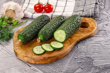 Raw green cucumbers with slices