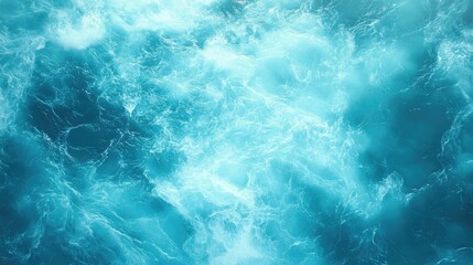 Fototapeta premium Aerial view of a churning ocean captures the dynamic movement of water, illustrating the powerful energy of the sea with ample space for text or graphics.