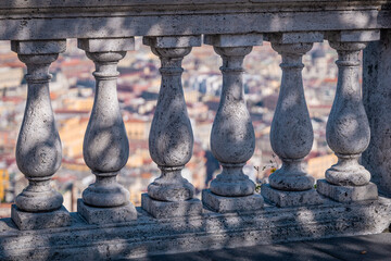 Concrete fence or marble wall overlooking the city of Napoli on a sunny summer or autumn day. Typical marble pillars above the city of Naples at the saint elmo fortress...