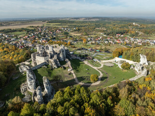 Aerial drone view of medieval castle Ogrodzieniec in Poland. Strongholds Eagles Nests in Polish Jurassic Highland in Silesia. Limestone rock castle ruins. Ogrodzieniec, Podzamcze castle in autumn.