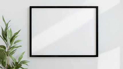 a blank horizontal poster mockup with a black frame, ideal for showcasing artwork or advertisements in a clean and minimalist style