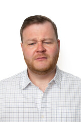 Obraz premium A Caucasian man with a puzzled expression reflects confusion, perfect for illustrating problem-solving or decision-making concepts
