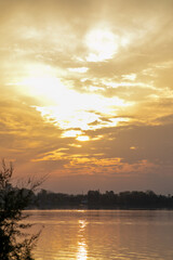 A serene sunrise over a calm river, symbolizing new beginnings and tranquility, perfect for illustrating mindfulness and meditation concepts