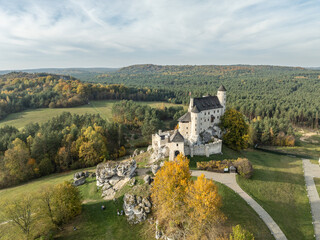 Aerial drone view of Bobolice Castle in autumn.Old medieval fortress, royal castle in the village of Bobolice, Poland.Strongholds Eagles Nests in Polish Jurassic Highland.Limestone rock castle ruins.