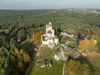 Fototapeta premium Aerial drone view of Bobolice Castle in autumn.Old medieval fortress, royal castle in the village of Bobolice, Poland.Strongholds Eagles Nests in Polish Jurassic Highland.Limestone rock castle ruins.