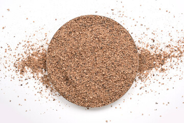 Ceylon organic dried nutmeg powder on white background. Nutmeg Powder. Ground Nutmeg.