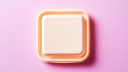 Mock-up concept for minimalist food packaging tray. An illustration of minimalist square container with a soft pastel orange rim, resting on a light pink surface, showcasing a clean and simple design