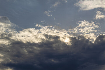 beautiful Sun shining through the puffy clouds. Sky view. gorgeous sunny sky. Background with...