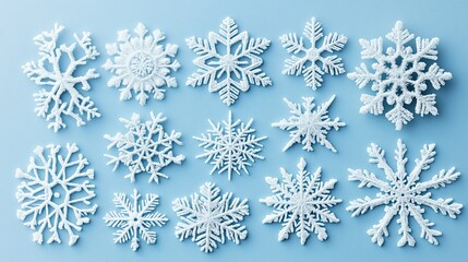 Elegant White Snowflakes on Soft Blue Background