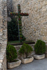 flowered cross in a niche