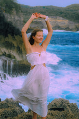 woman in dress on the beach