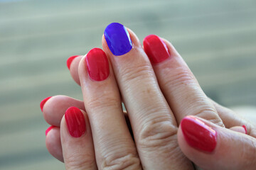 Painted nails on a frame hand 