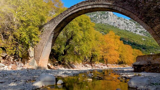 Autumn view of the famous Portaikos arched, stonebridge in Trikala, Greece