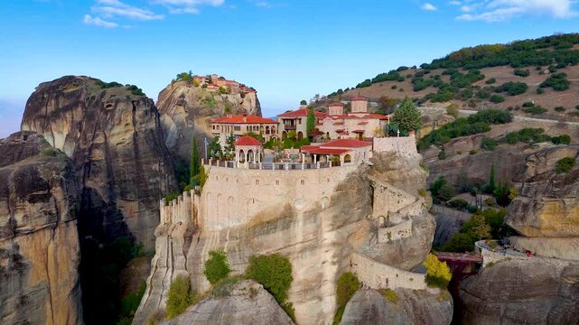 Aerial sunrise view of the steep mountains at Meteora, Kalambaka, Greece, with the famous holy monasteries