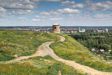 The tower of an ancient Bulgarian fortress on a high cliff on the banks of the Kama River, Elabuga,...