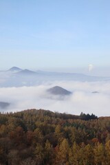 view of the inversion in the valley. only the tops of the hills are visible.
