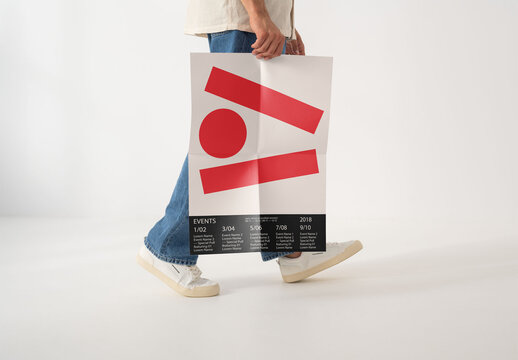 Mockup Of Man Walking Holding Customizable A2 Poster